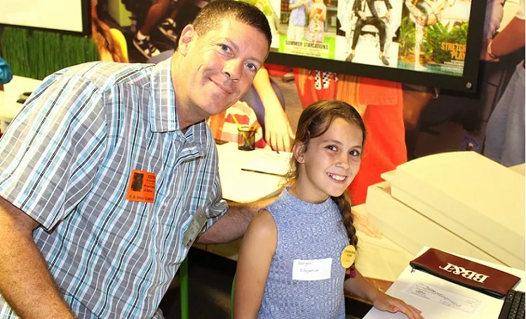 A volunteer mentor smiling