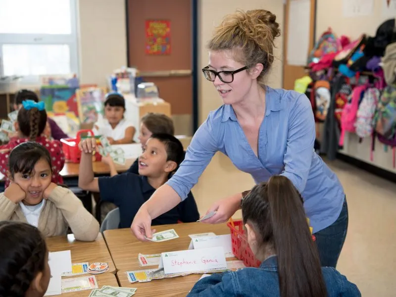 Students engaged in a hands-on Junior Achievement learning experience